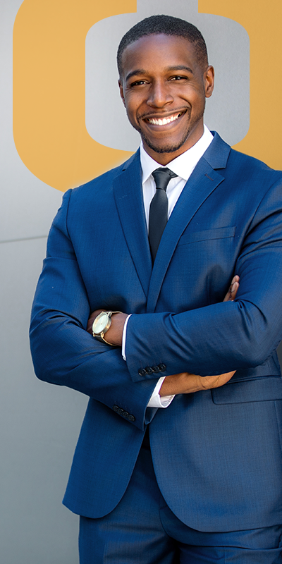 Attractive black man standing against a wall on the Archive page